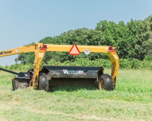 Vermeer mower conditioner mowing wet field