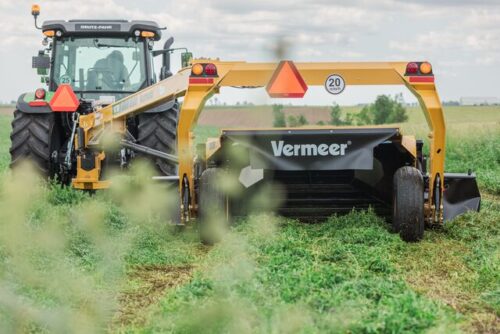 Vermeer mower conditioner working in the field