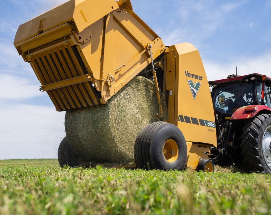 A 605S Signature baler ejects a bale. 